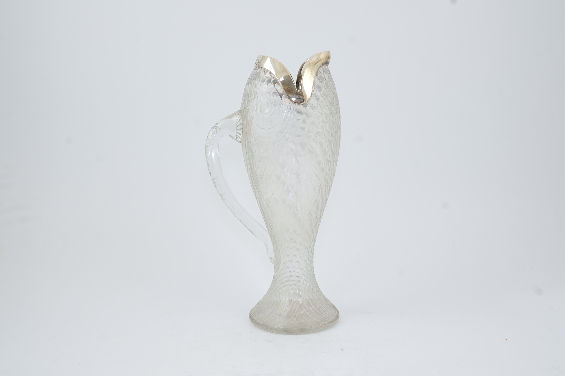 An unusual late Victorian novelty silver mounted single handled cut glass jug, modelled as a fish, by Hukin & Heath